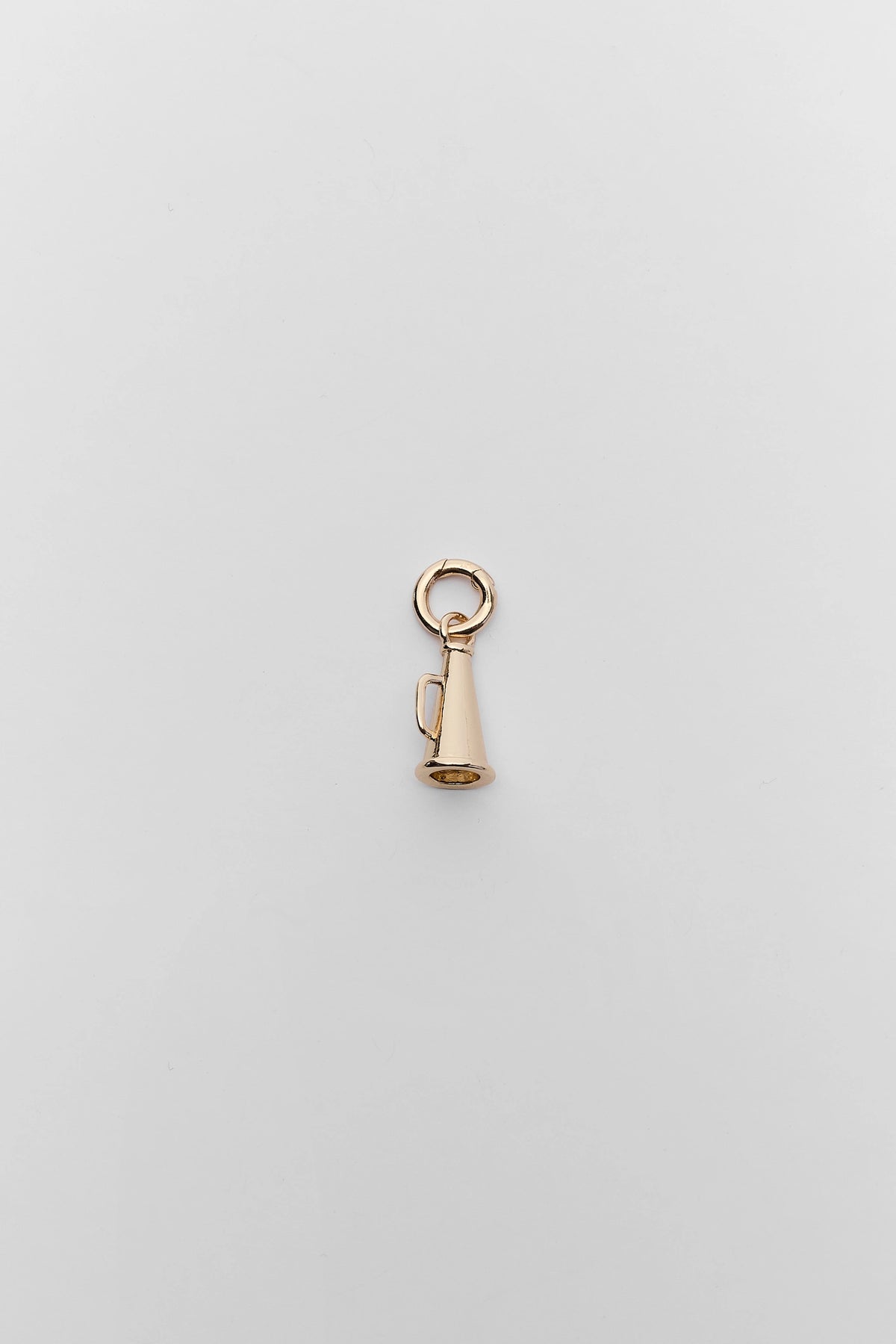 Gold megaphone charm with ring clasp, flat lay on gray background - game day jewelry | Avara