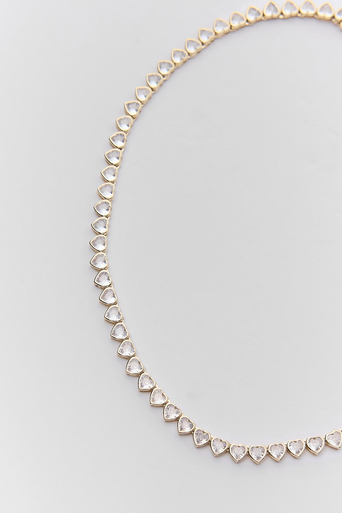 Gold Heart Rhinestone Tennis Necklace - Close-Up Detail of Bezel-Set Heart Stones | Avara