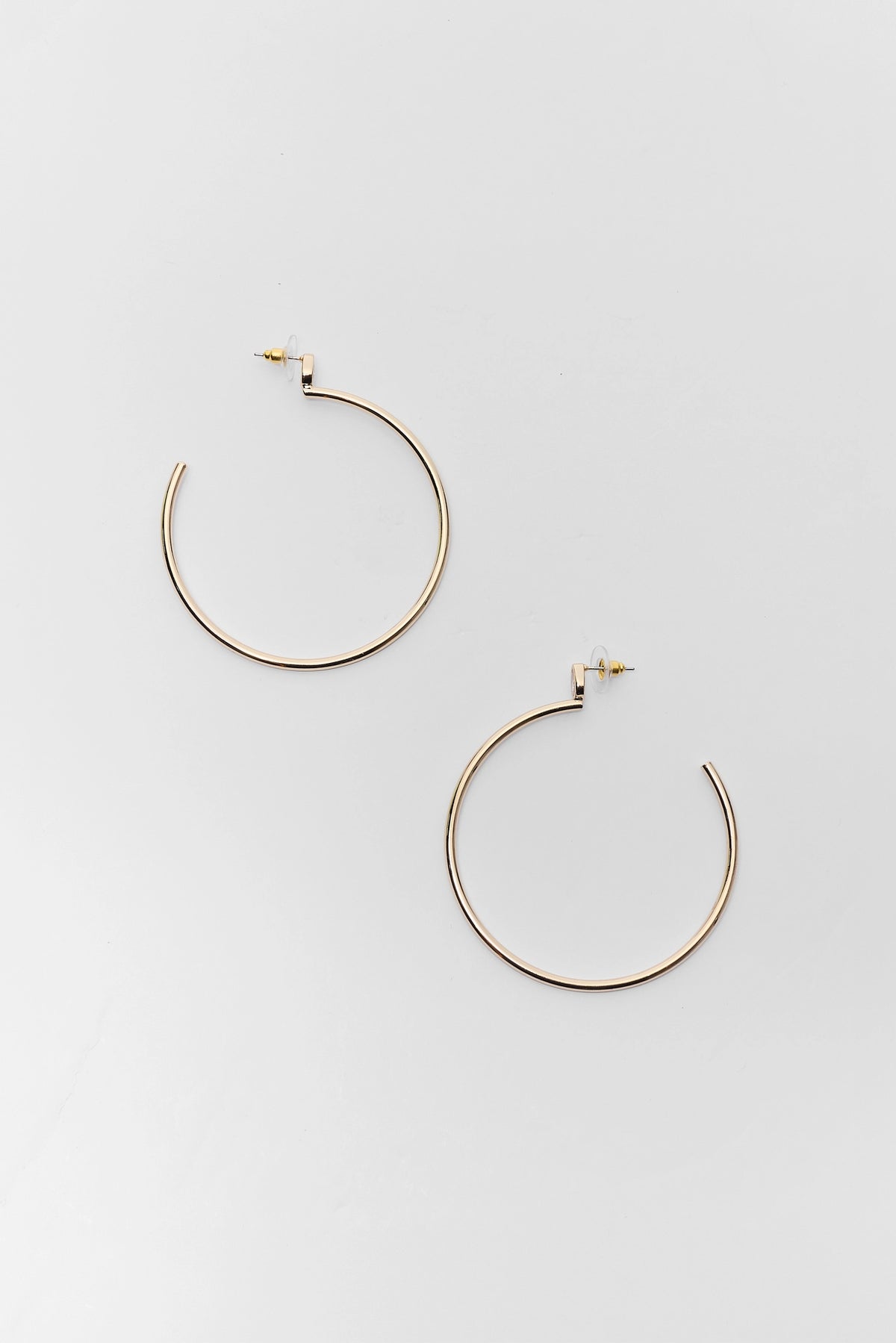 Gold Rhinestone Thin Hoop Earrings with post backings - Flat Lay | Avara
