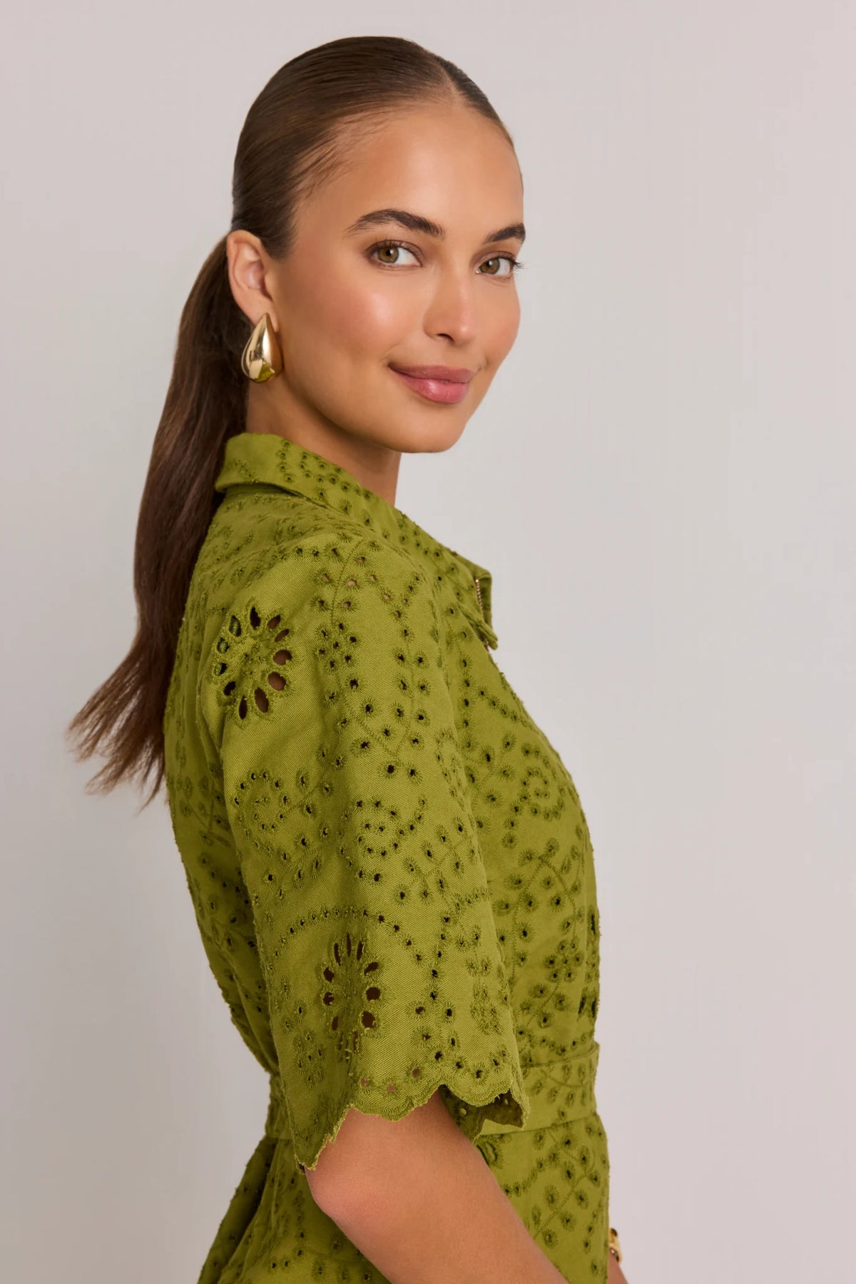 Olive Green Eyelet Short Dress - Side Profile Close-Up with Scallop Sleeve | Avara