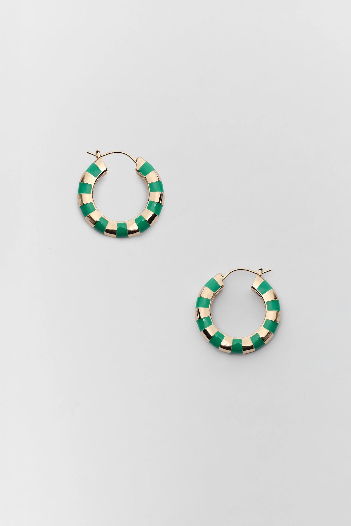 Green and gold striped enamel hoop earrings, pair flat lay view - game day accessories | Avara