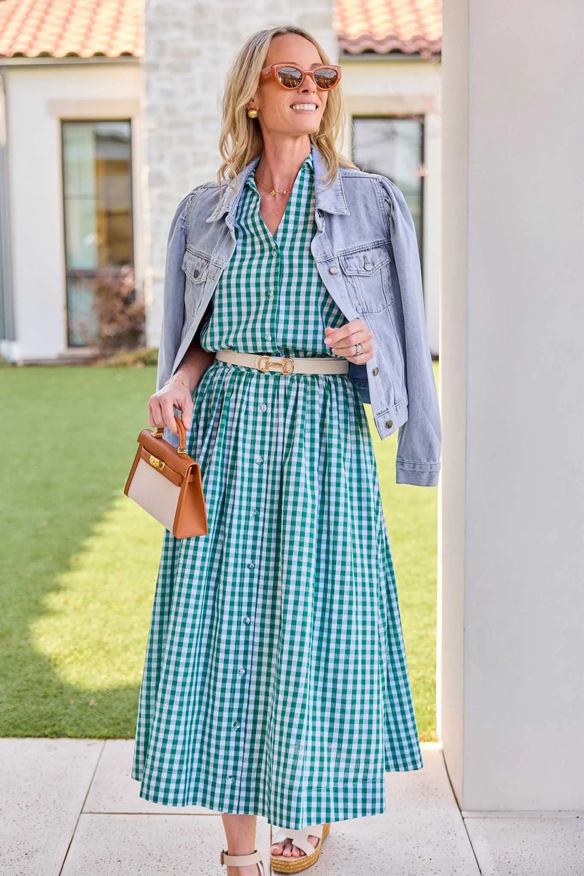 Green gingham top styled with matching midi skirt, denim jacket, and sandals - Styled Look | Avara