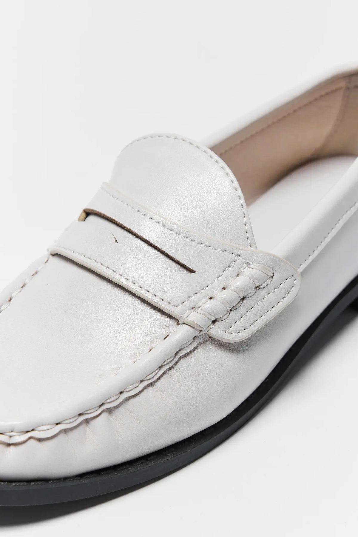 Jacklyn Cream Faux Leather Loafer - Close-Up Penny Strap Detail | Avara