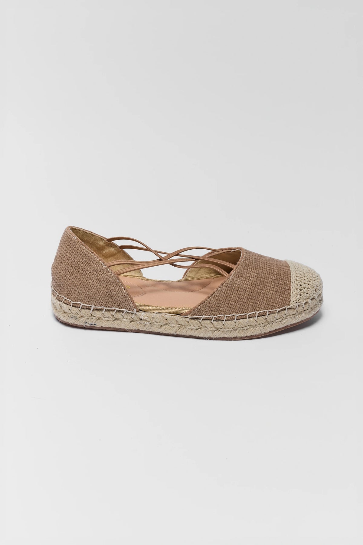 Tan women's flat espadrille with woven jute sole and lace-up strap - Side Profile | Avara