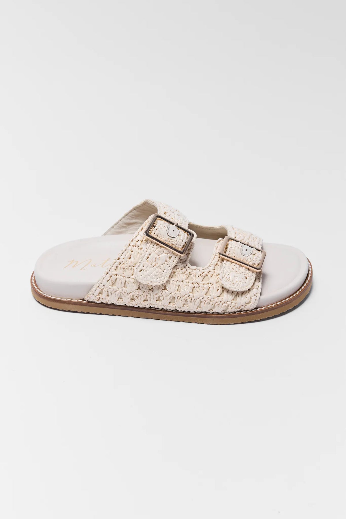 Tan woven raffia double-buckle slide sandal by Matisse, side profile view | Avara