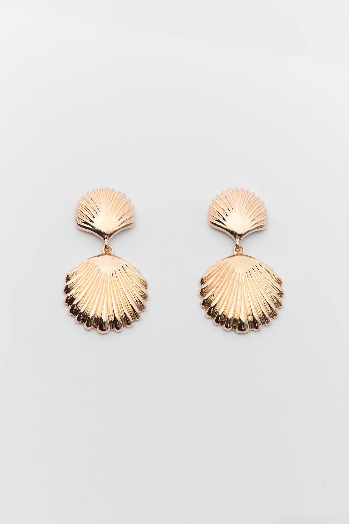 Kaia Gold Shell Drop Earrings - Fluted double-shell detail, flat lay | Avara