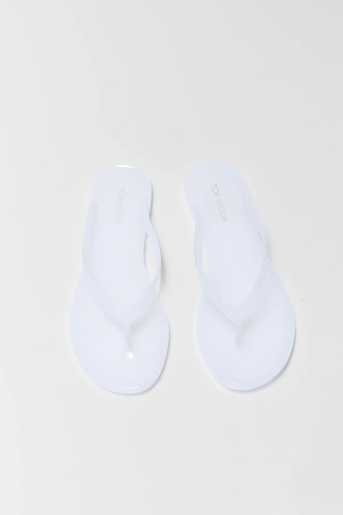 Kathy White Jelly Flip Flop Sandals - Top Down Flat Lay | Avara
