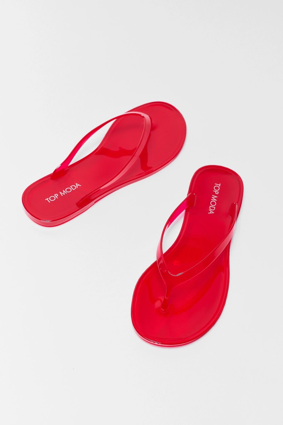 Red Jelly Flip Flop Sandals - Overhead Pair View with Top Moda Branding | Avara
