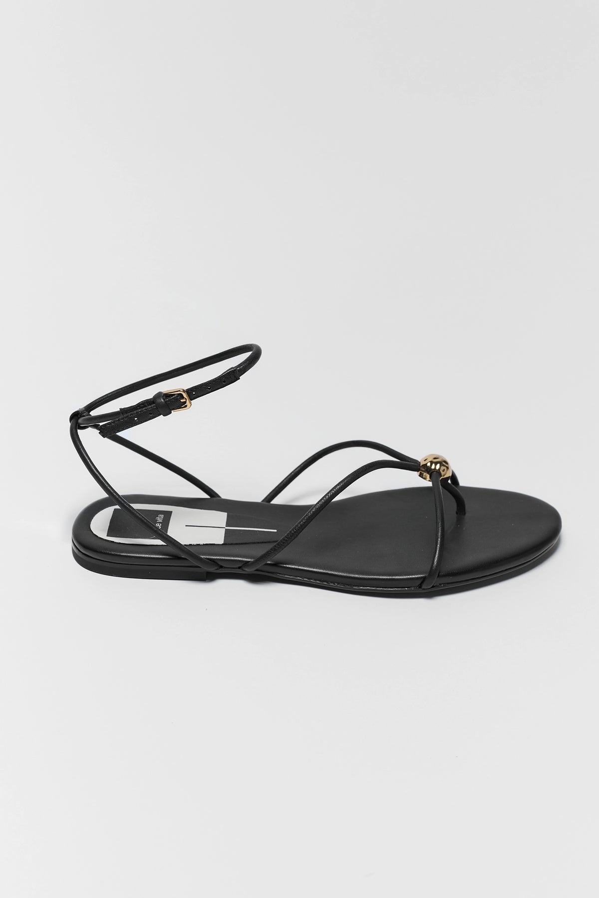 Black leather Kenley sandal with thin straps, gold accent, and ankle buckle - Side Profile | Avara