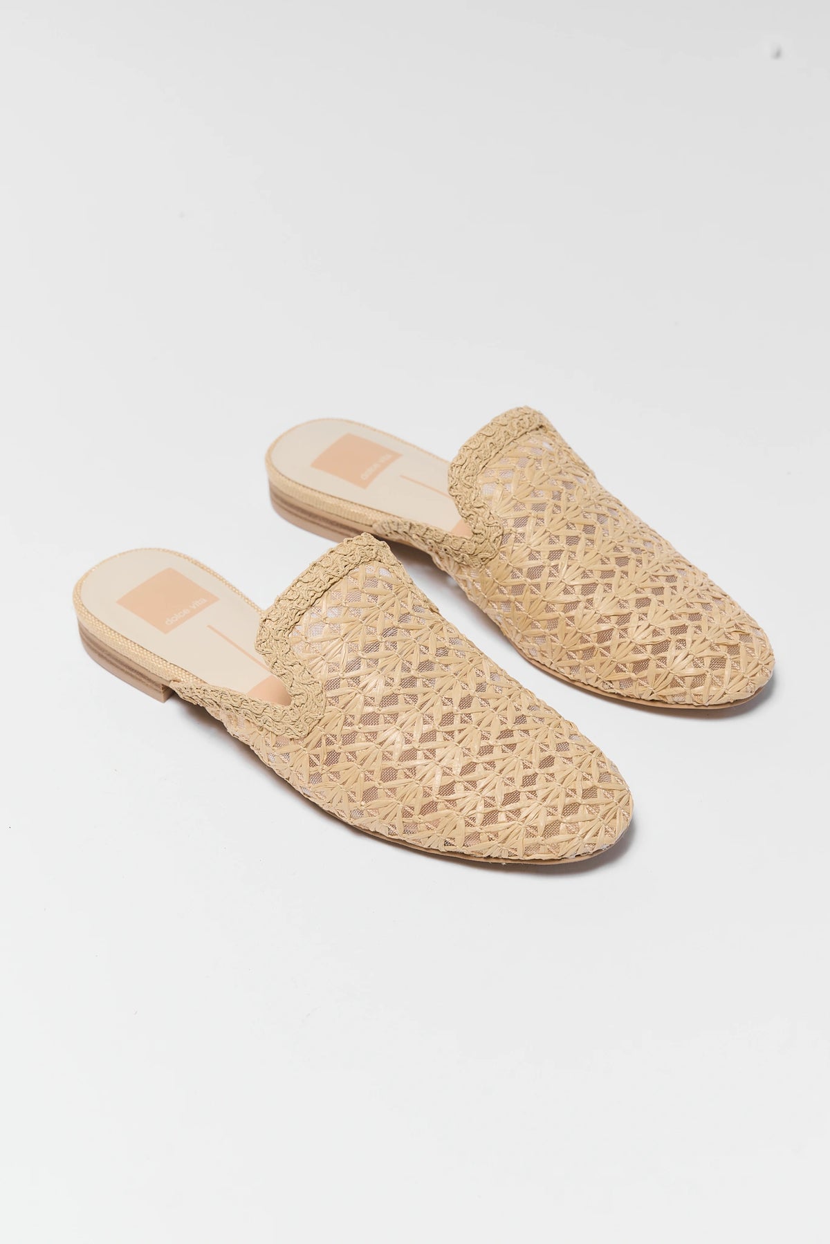 Tan woven raffia mules pair angled front view - Dolce Vita Kirt | Avara