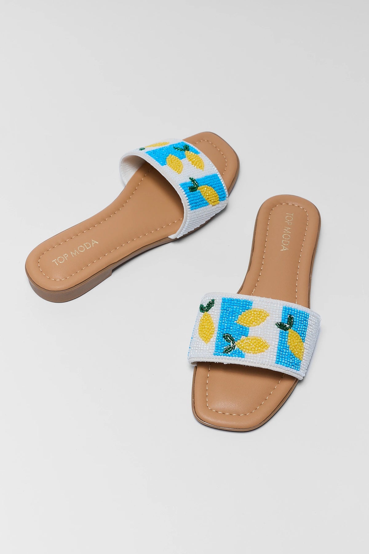 Lemon Beaded Slip On Sandals - Pair Angled View, Blue & White Beaded Strap | Avara