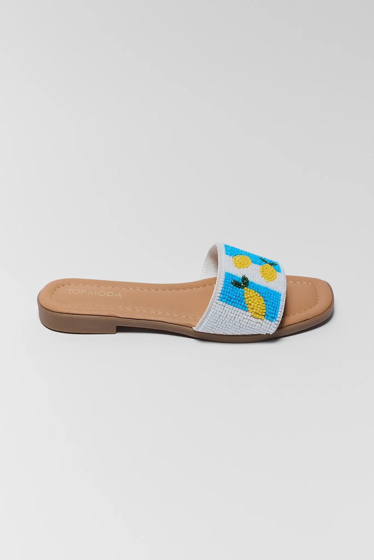 Lemon Beaded Slip On Sandals - Side Profile, Yellow Lemon Beaded Detail on Blue Stripe | Avara