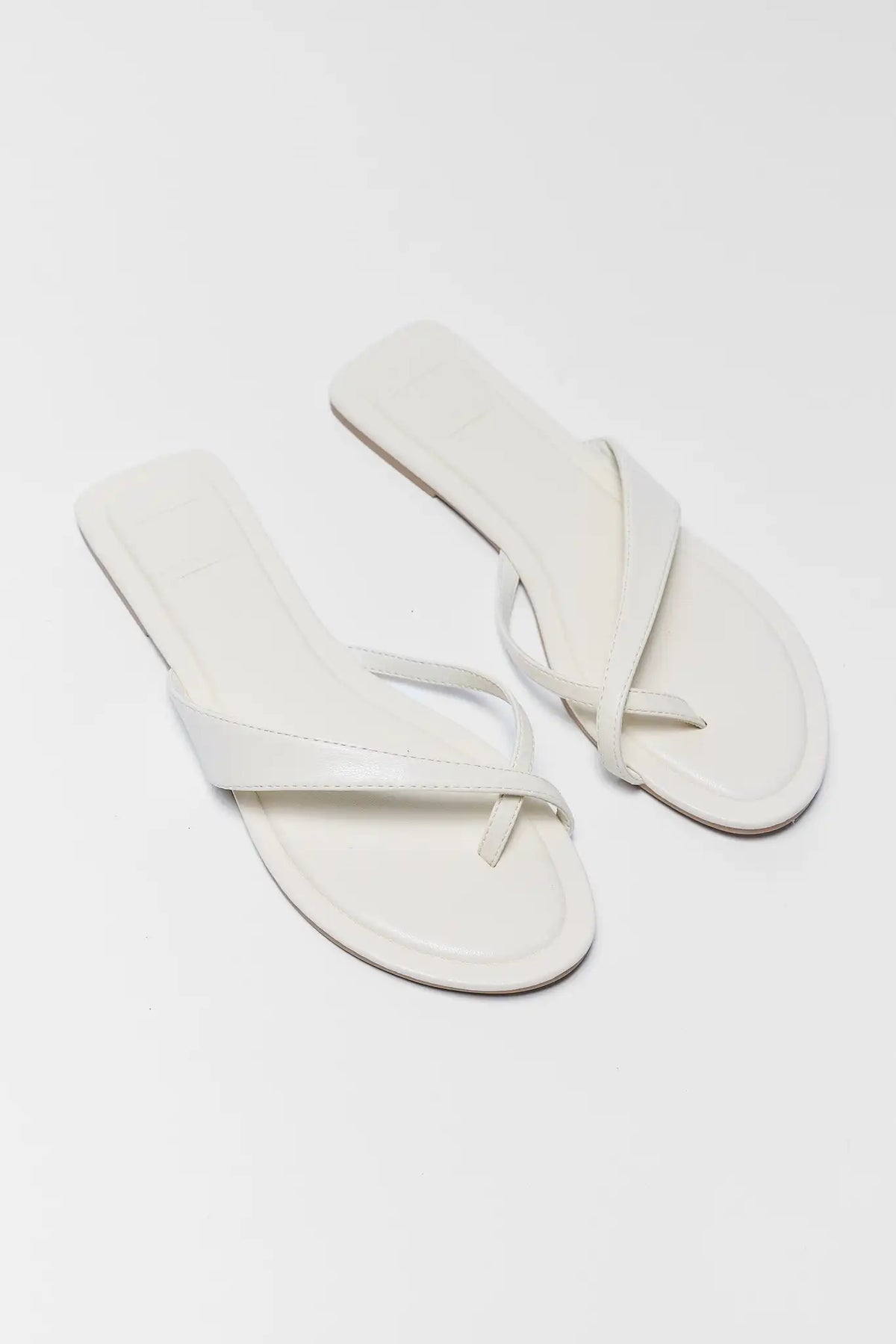 Pair of white crossover sandals angled flat lay - Dolce Vita Lenex | Avara