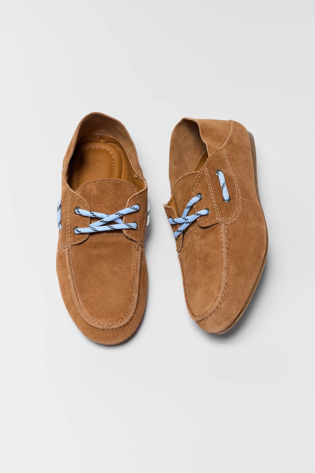 Pair of light brown suede boat shoes with blue paracord laces - Top View | Avara