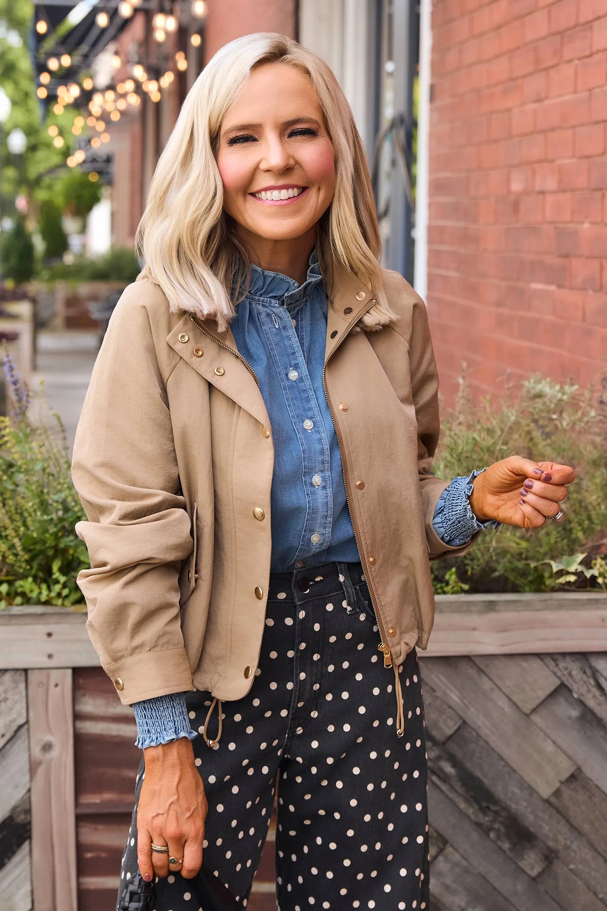 Taupe Cropped Bomber Jacket - On Model Outdoor Lifestyle, Styled with Denim - Front View | Avara