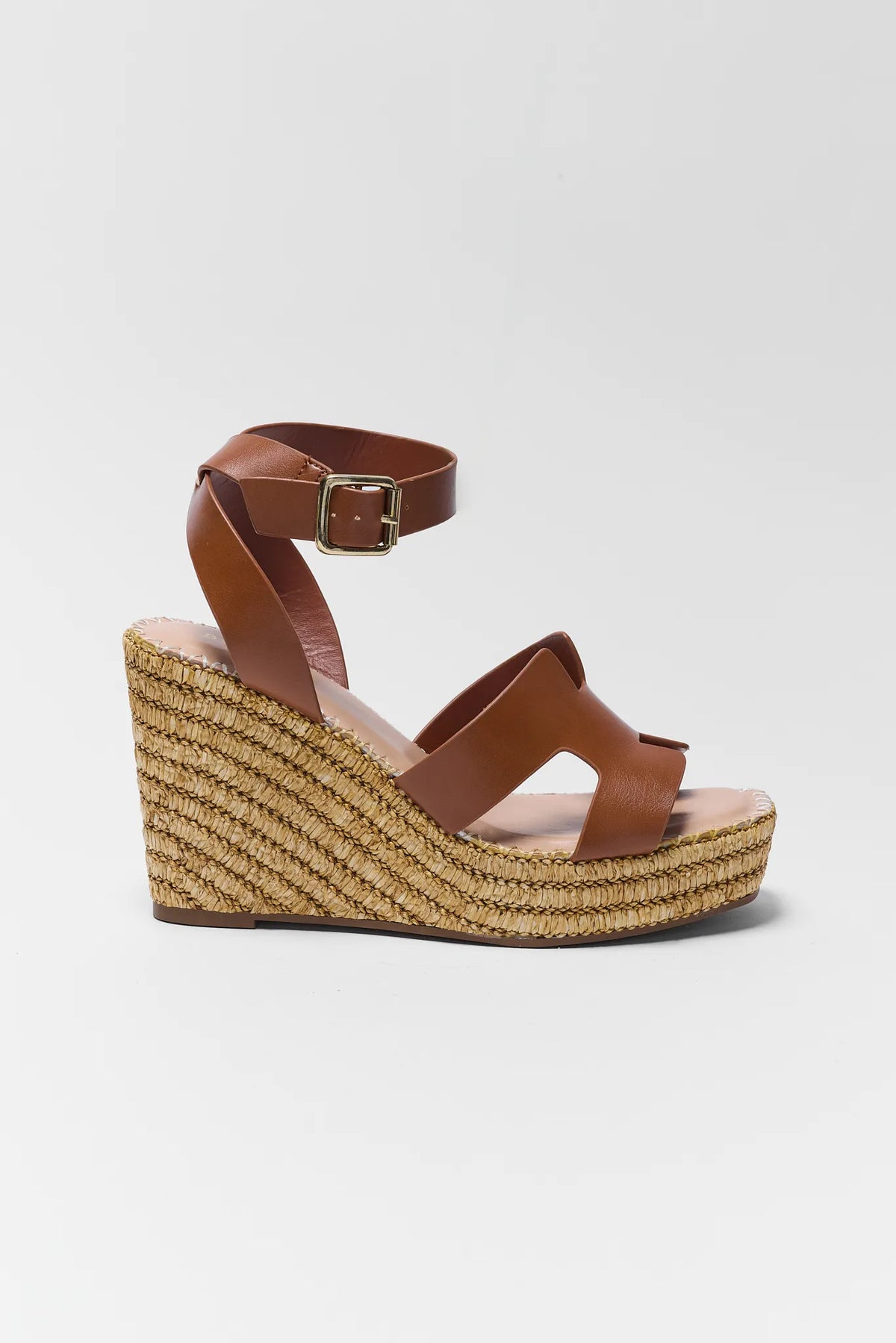 Brown faux leather wedge sandal with raffia espadrille platform and gold buckle strap - Side View | Avara