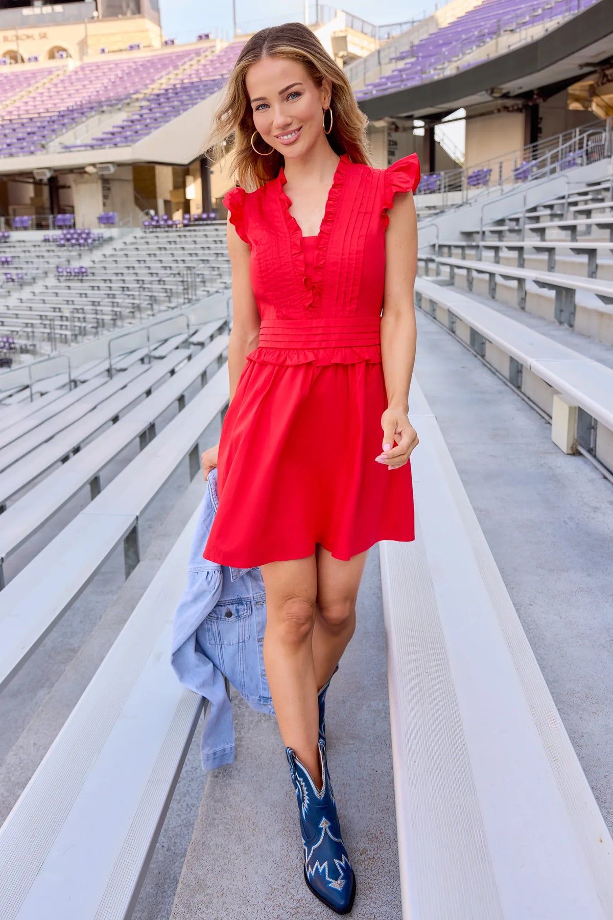 Makayla Red Flutter Sleeve Short Dress styled with blue western boots at a stadium - Game Day Look | Avara