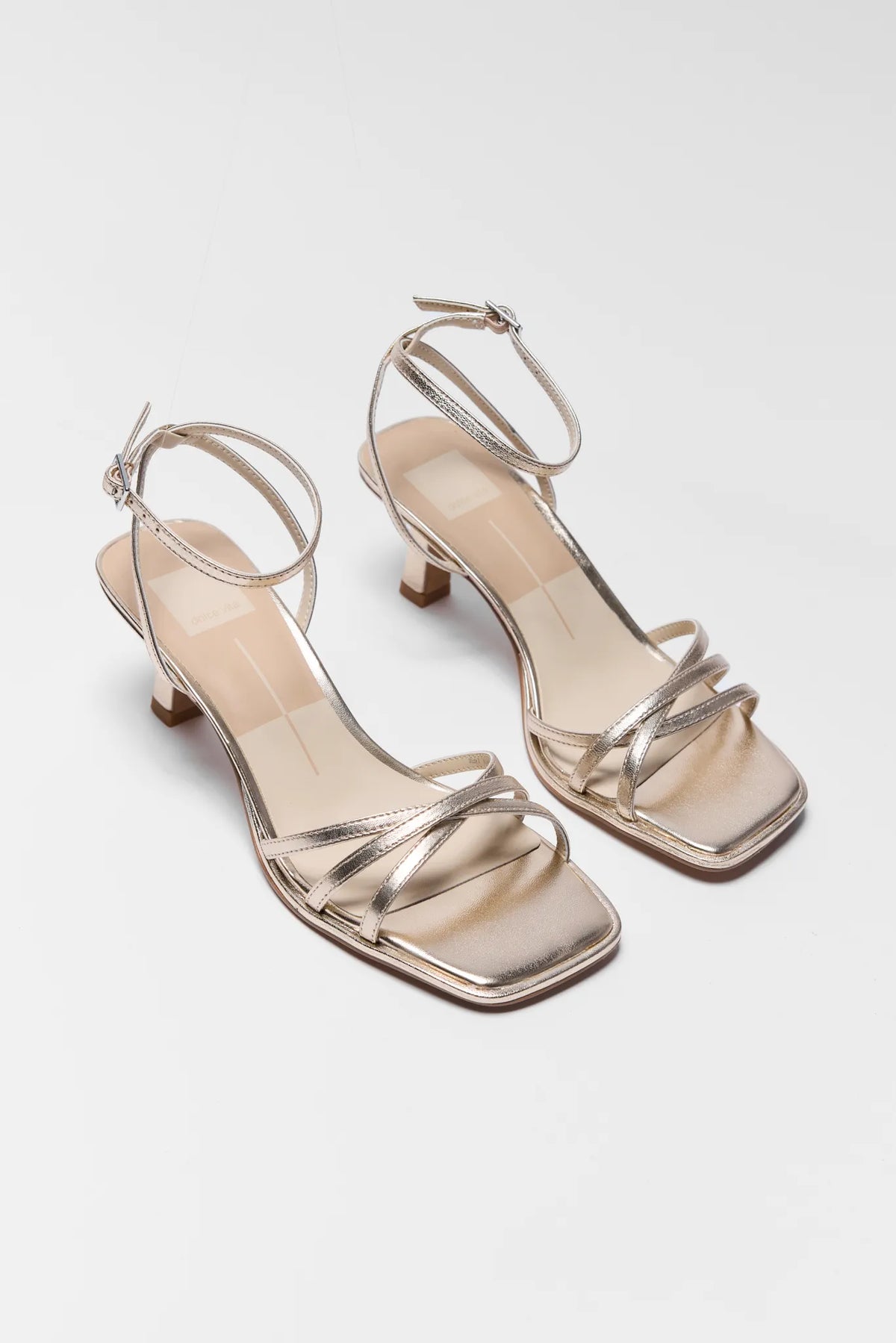 Dolce Vita Manji Gold Metallic Strappy Kitten Heel Sandals - Pair Front View | Avara