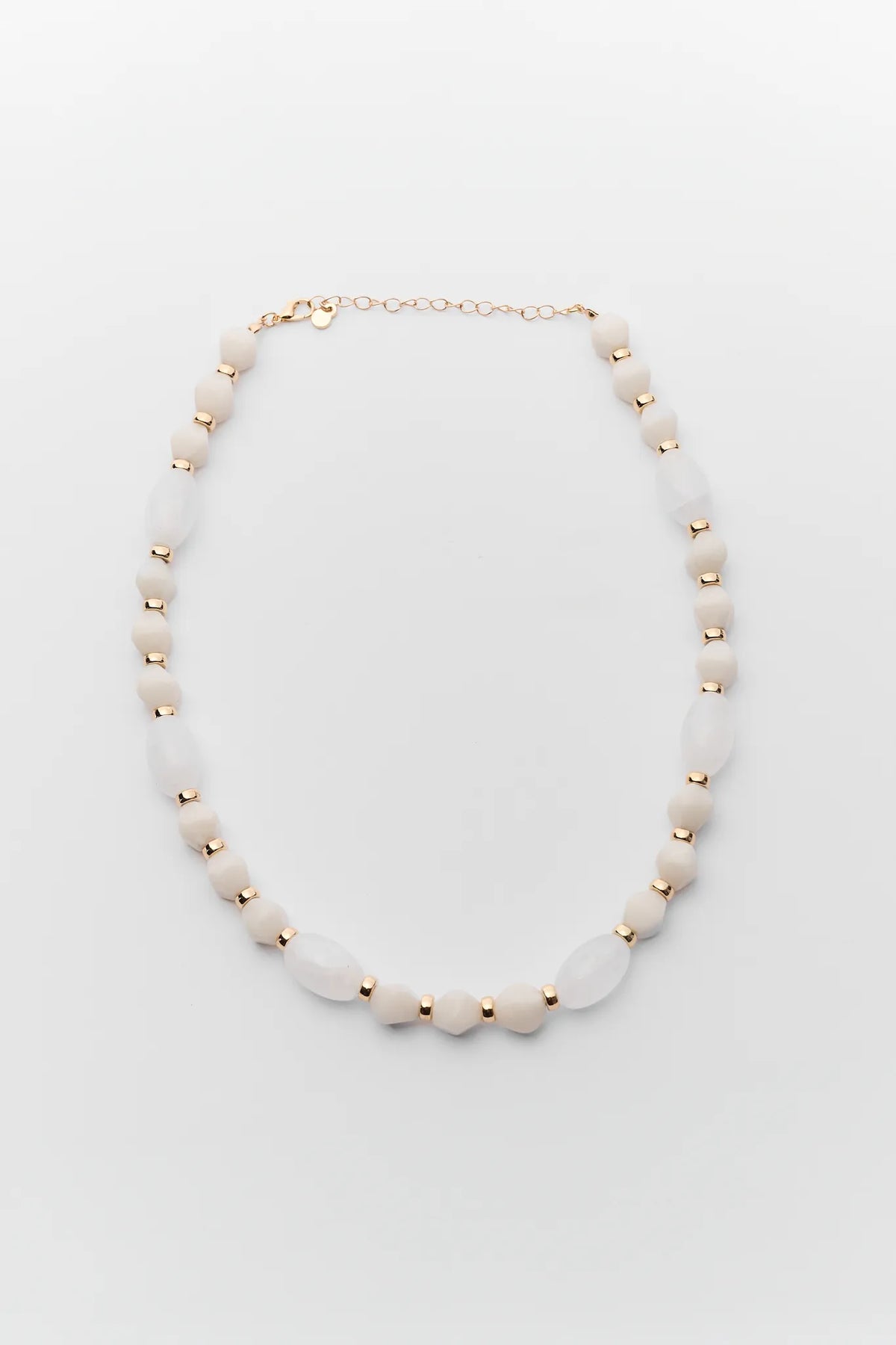 Maris Ivory Beaded Necklace with gold accent beads and adjustable chain clasp - Flat Lay | Avara