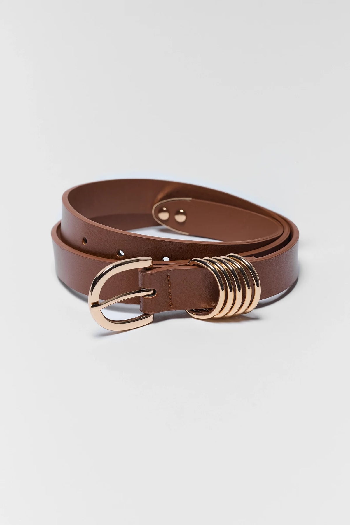 Marley Brown Faux Leather Belt with gold-tone buckle and multi-ring hardware detail - Coiled View | Avara