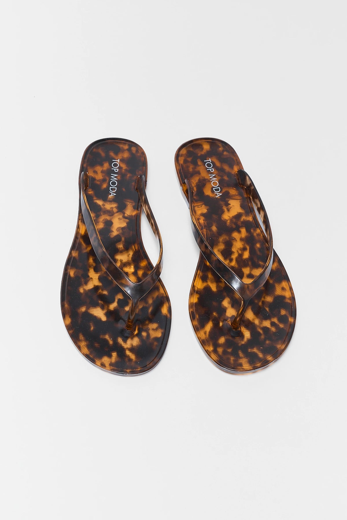 Marley Tortoise Jelly Sandals pair front flat lay - tortoise jelly flip flops with glossy finish | Avara
