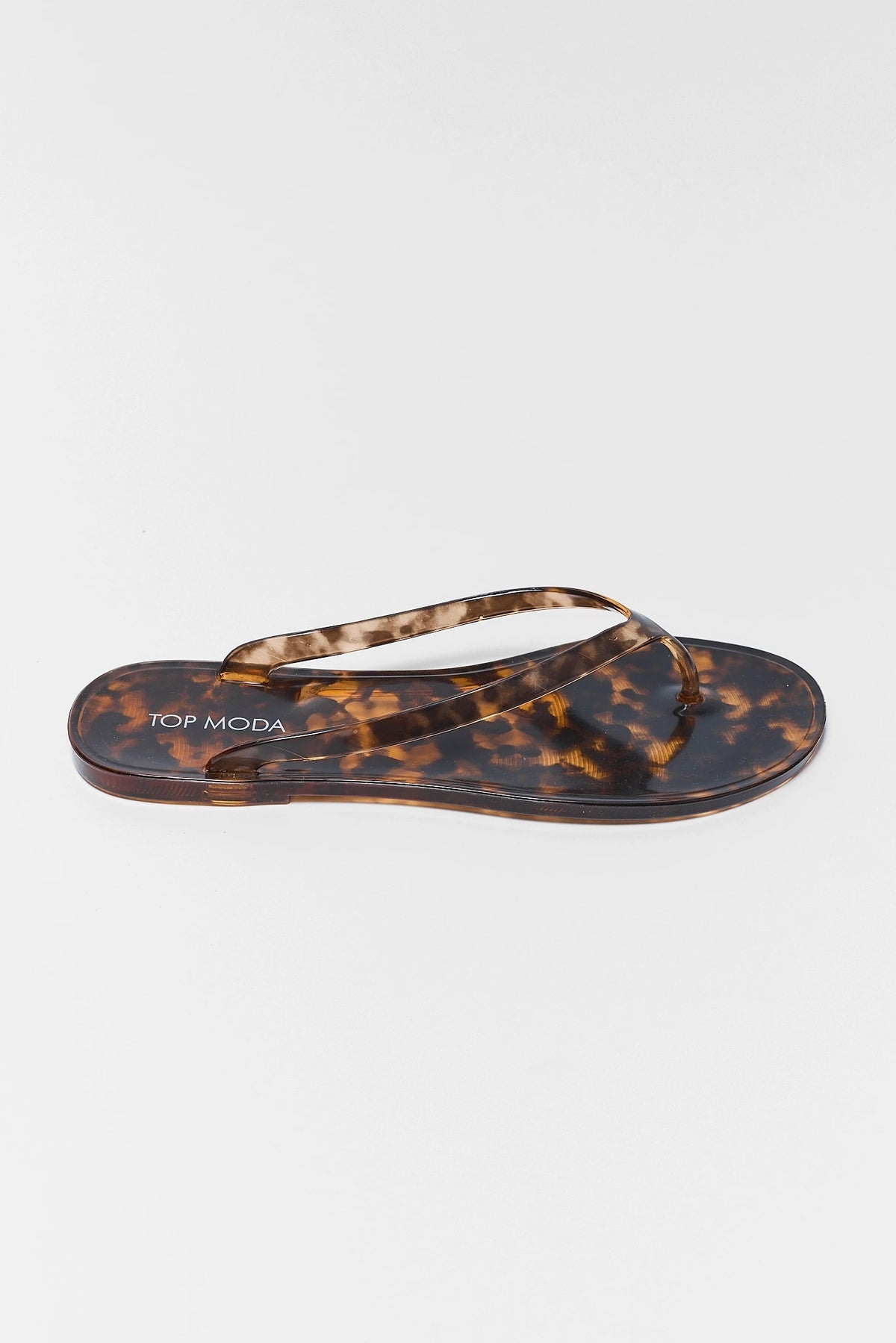 Marley Tortoise Jelly Sandal single shoe side profile - flat thong strap tortoiseshell jelly sandal | Avara