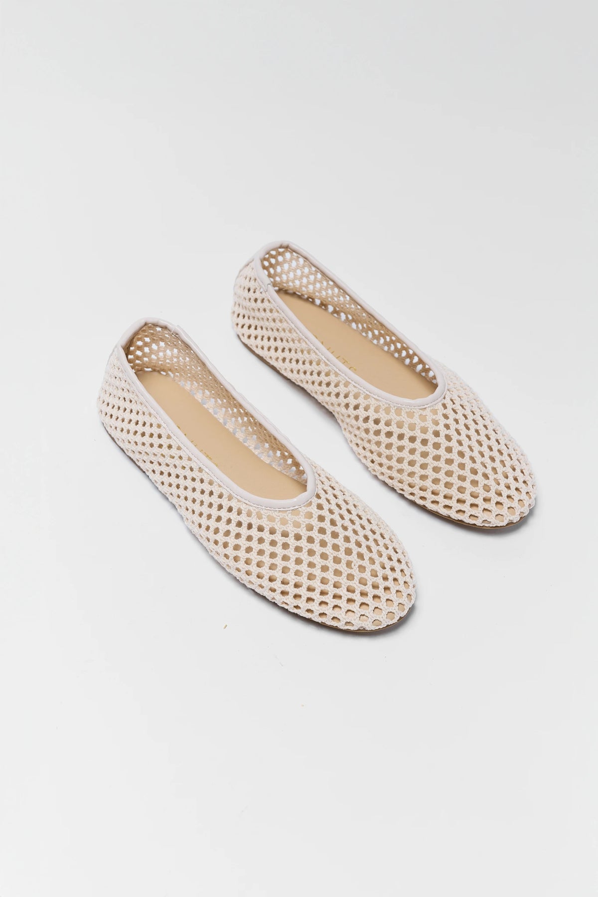 Pair of cream woven flats overhead close-up showing honeycomb mesh texture and rounded toe - Matisse Marta | Avara