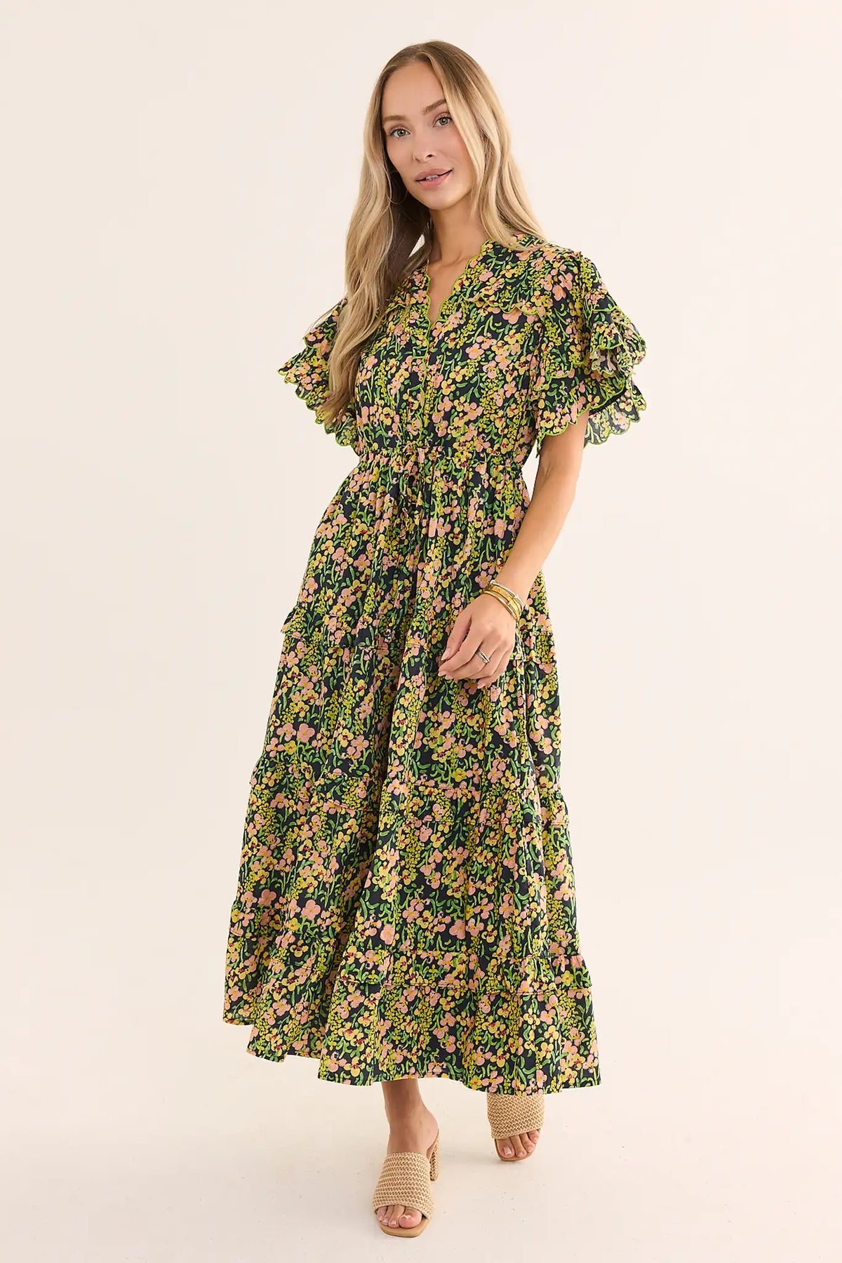 Carly Multi Printed Floral Maxi Dress, black with pink & yellow blooms, ruffle sleeves, front view on model | Avara