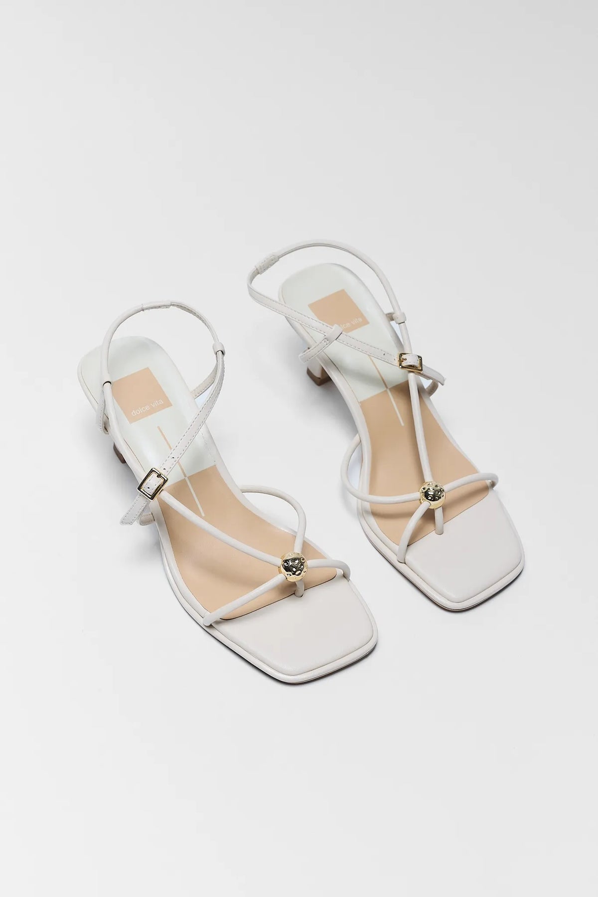 Dolce Vita Mylee Cream Strappy Kitten Heels - Angled Pair Flat Lay | Avara