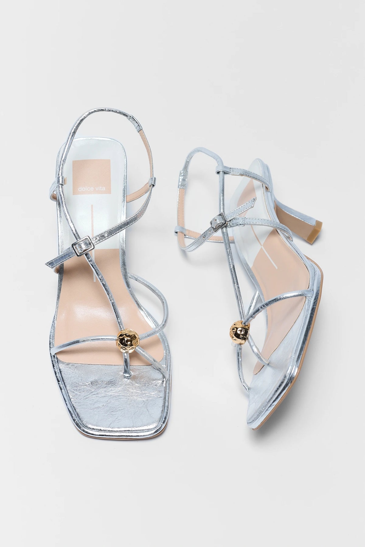 Mylee Silver Strappy Kitten Heels by Dolce Vita - Top-Down Pair View with Gold Ball Toe Detail | Avara