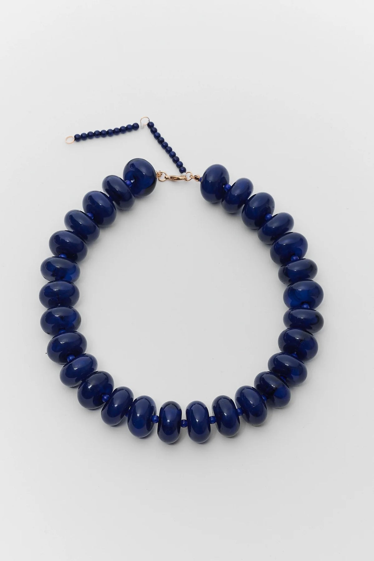 Navy Oversized Beaded Necklace - Flat Lay with Gold Clasp Detail | Avara