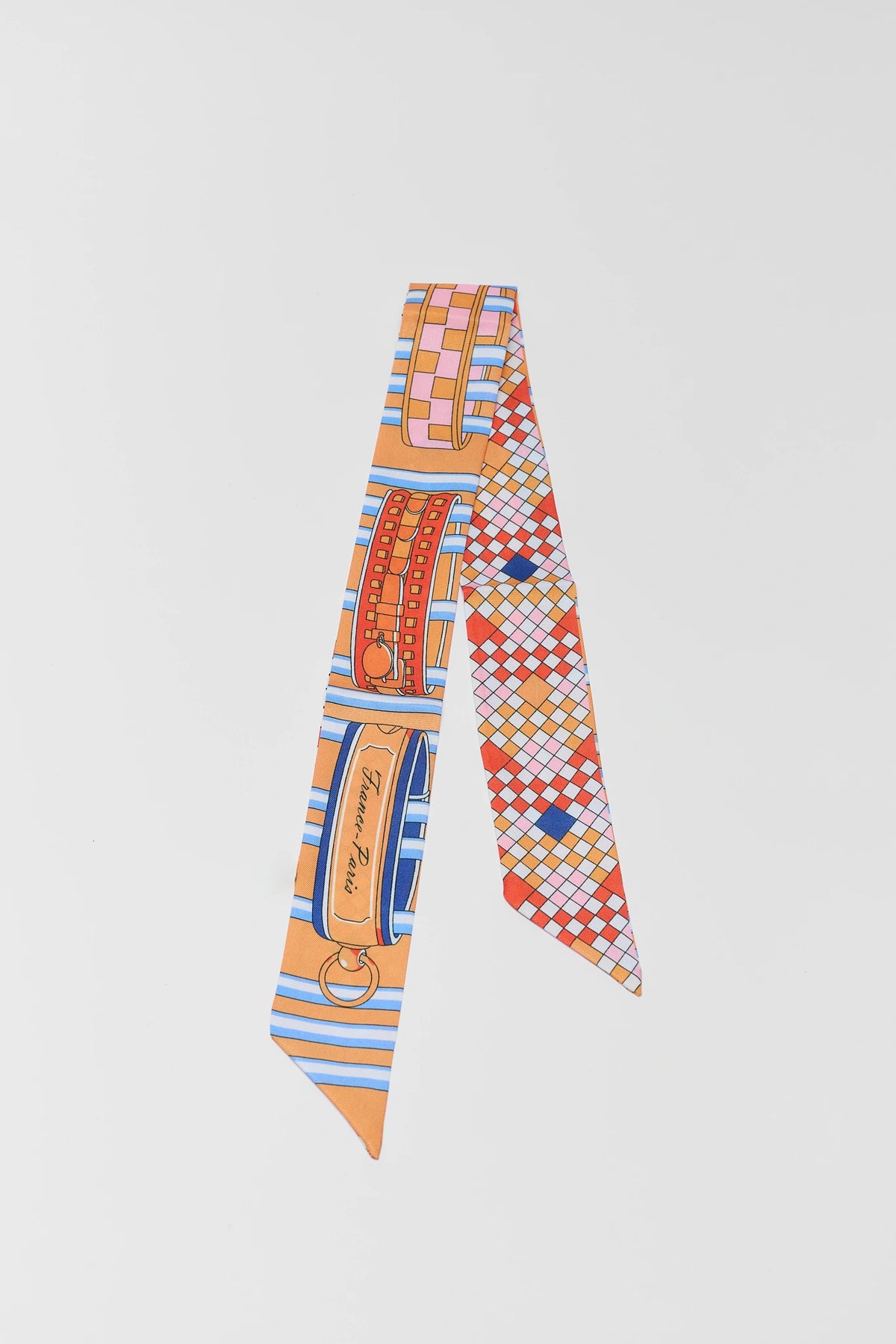 Orange multi-print skinny scarf with colorful patterned design - Flat Lay | Avara