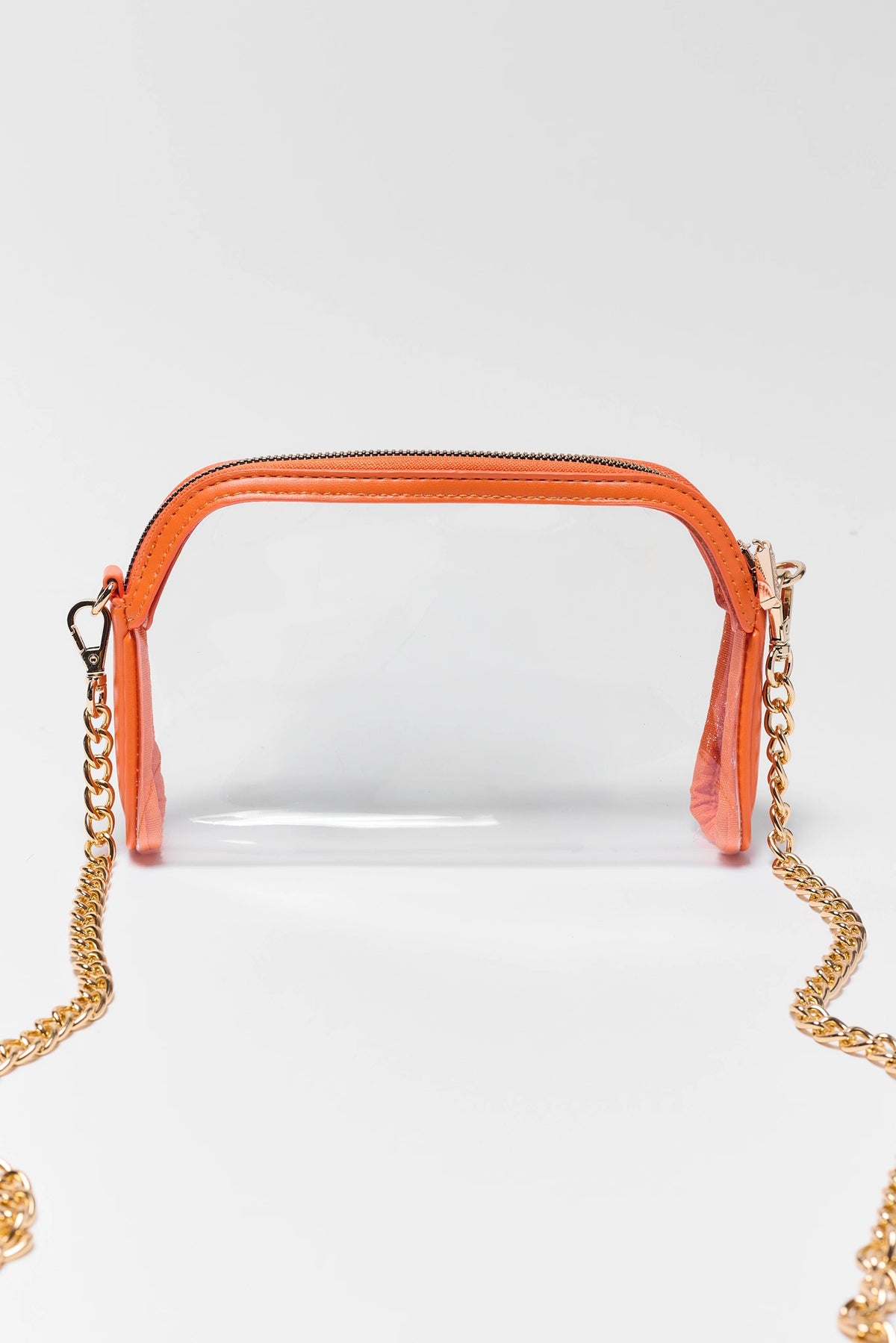 Orange trim clear crossbody bag with gold chain strap, front view — stadium-friendly orange clear purse | Avara