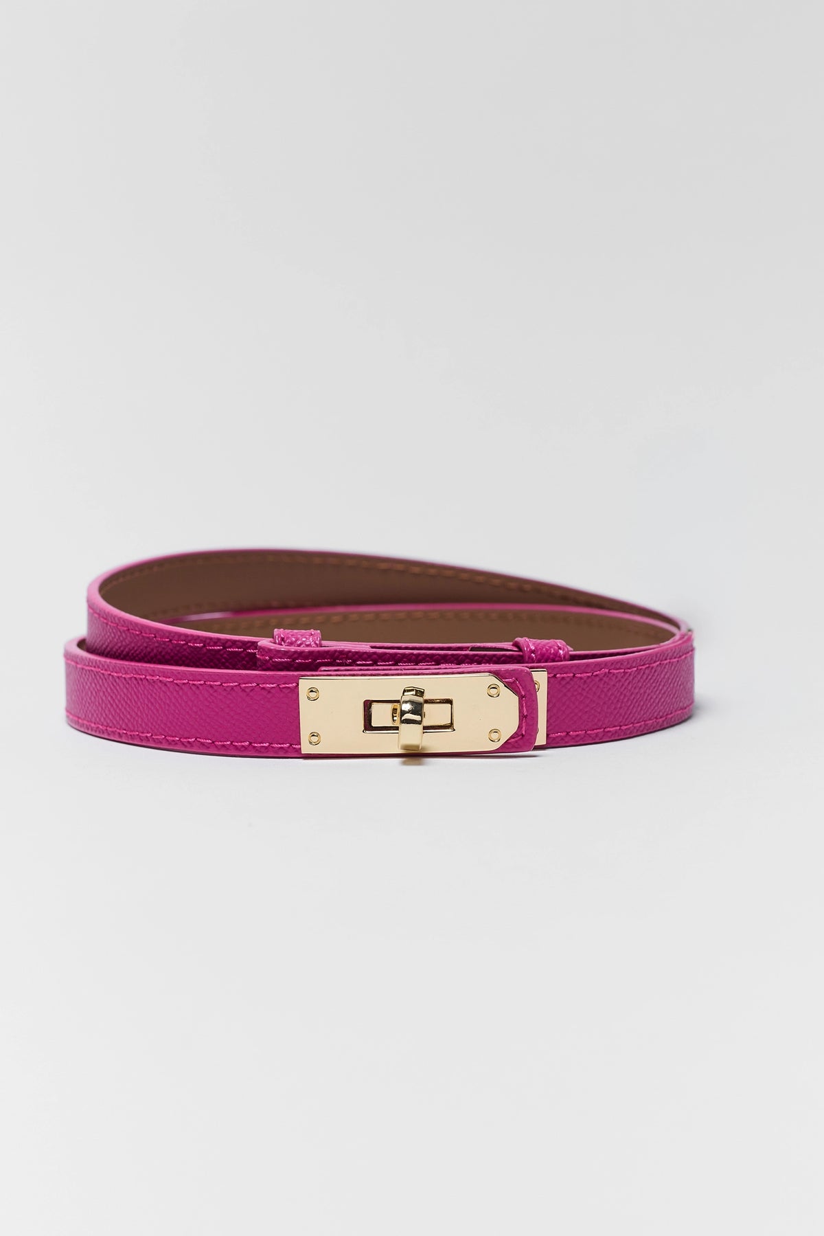 Piper Pink Faux Leather Belt coiled, gold-tone turn-lock clasp, women's accessory - Flat Lay | Avara