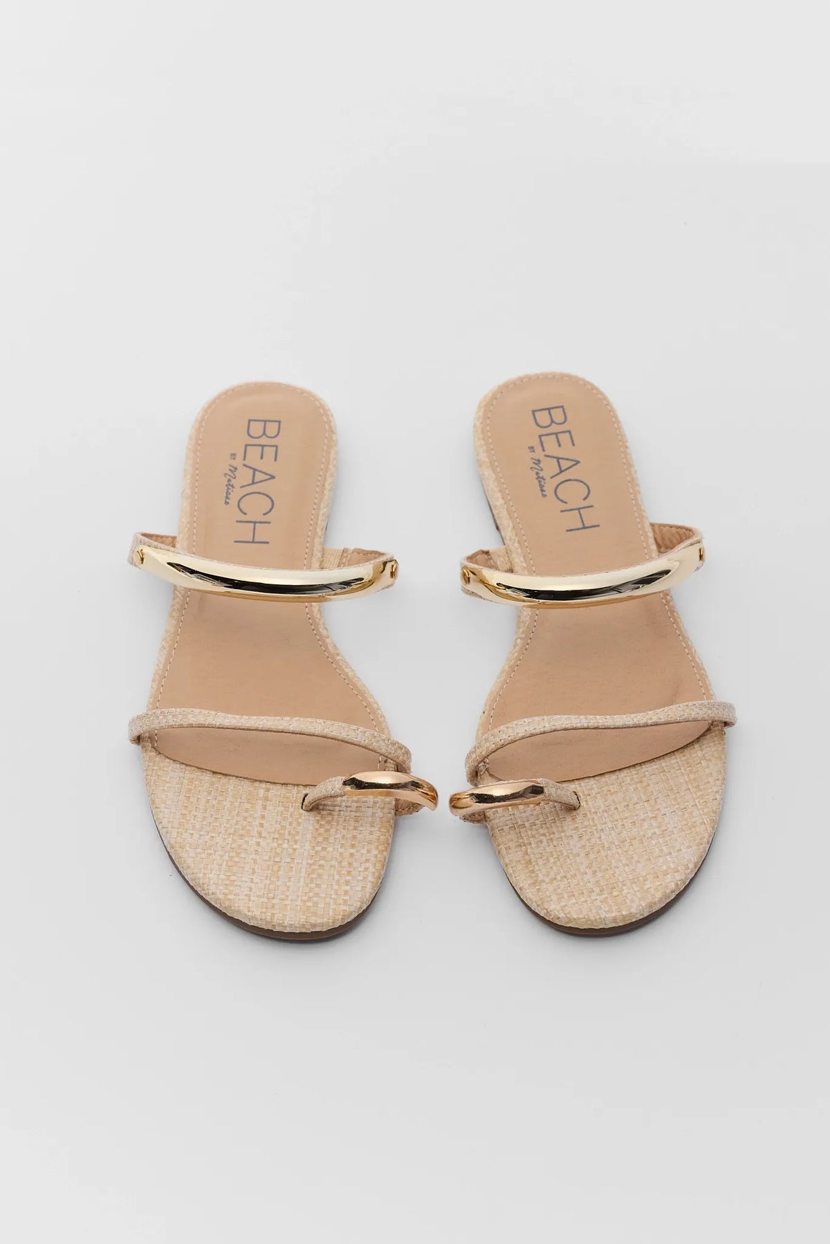 Natural raffia gold detail sandals pair, top-down front view highlighting gold bar hardware straps | Avara