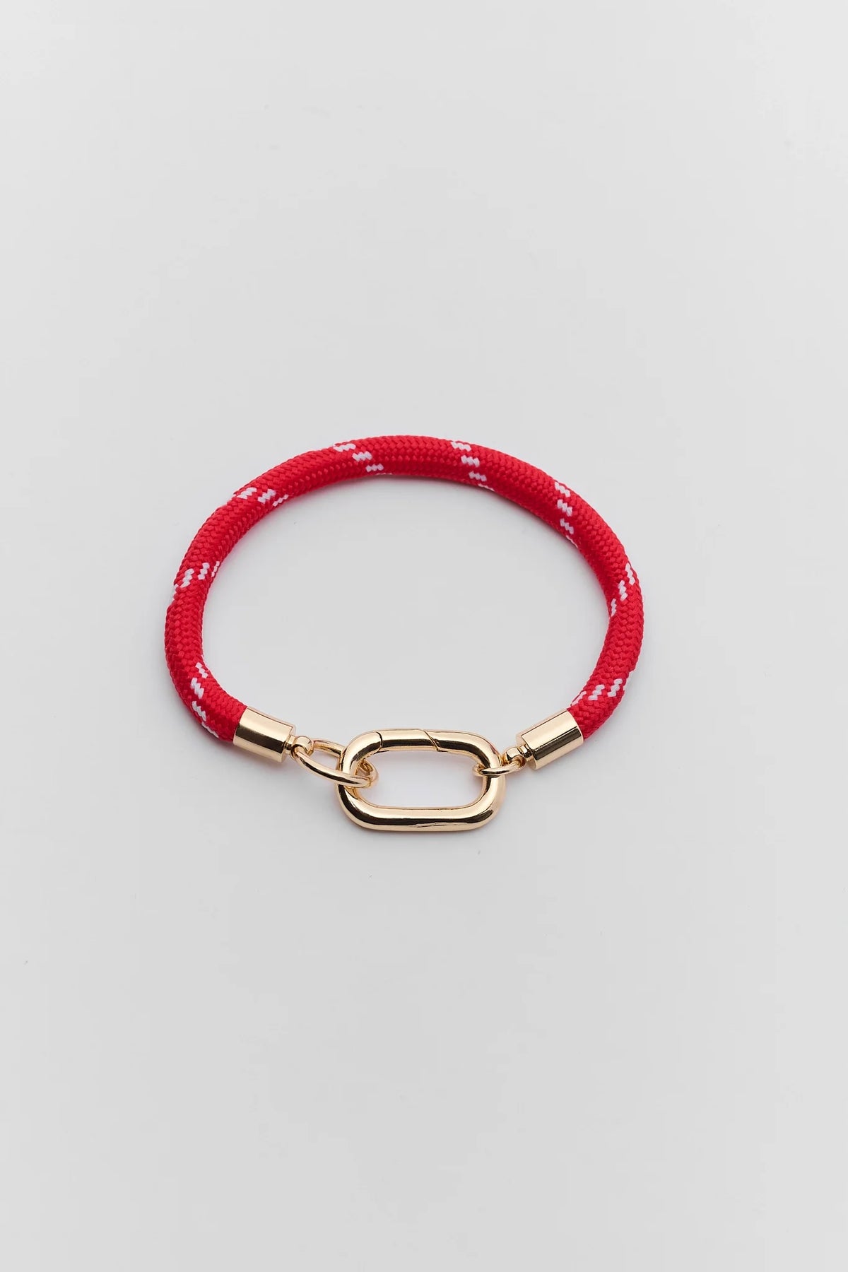 Red cord carabiner bracelet with gold-tone oval clasp - Flat Lay | Avara