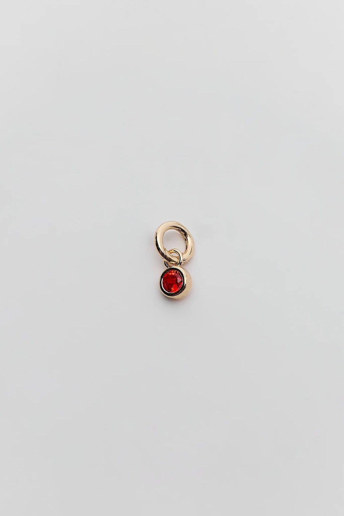 Red Rhinestone Charm with gold ring connector and round bezel-set red gemstone - Product Detail | Avara