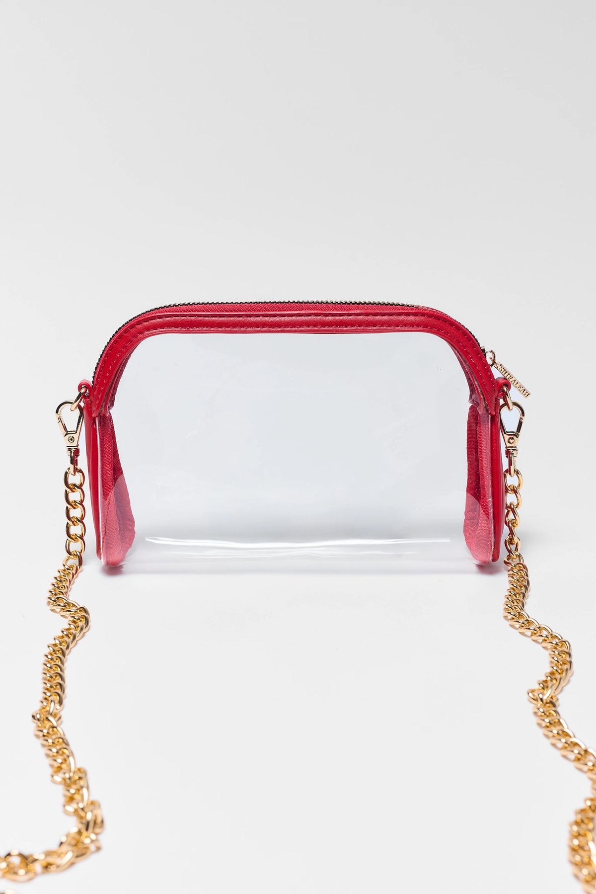 Red Trim Clear Crossbody Bag with gold chain strap - Front View | Avara