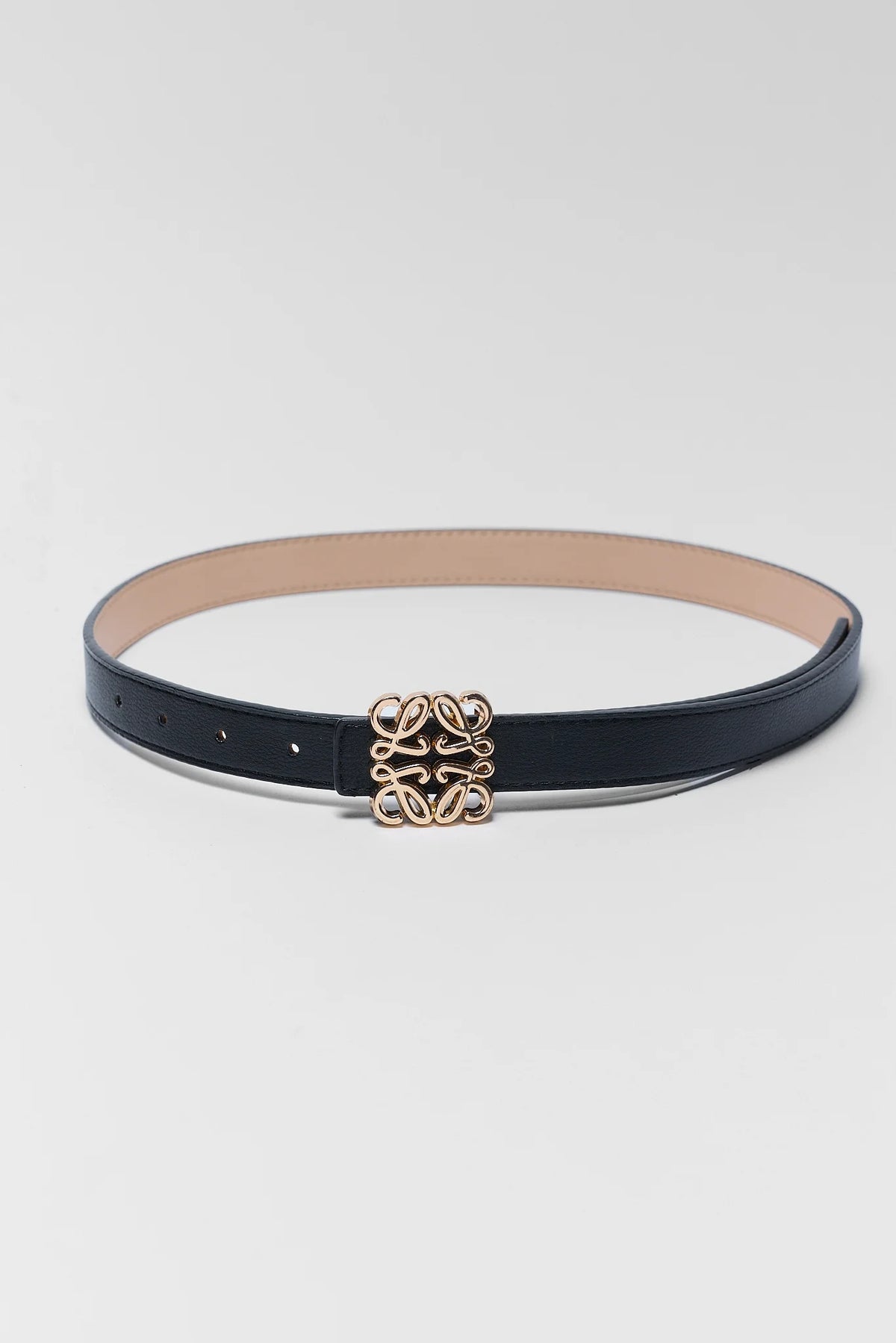 Rowan Black Faux Leather Belt laid flat, slim silhouette with gold-tone logo buckle - Flat Lay | Avara