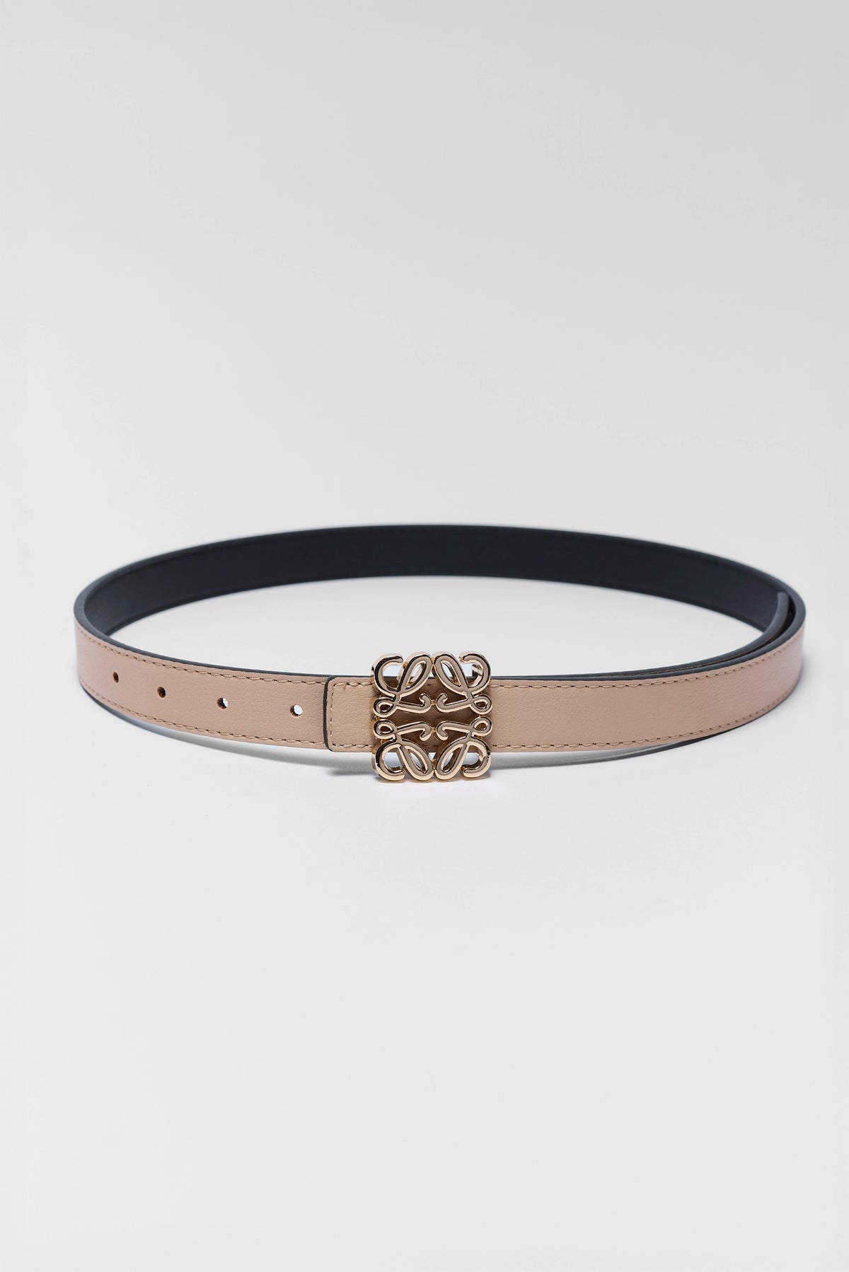 Rowan Tan Faux Leather Belt laid flat, slim silhouette with gold-tone logo buckle - Flat Lay | Avara