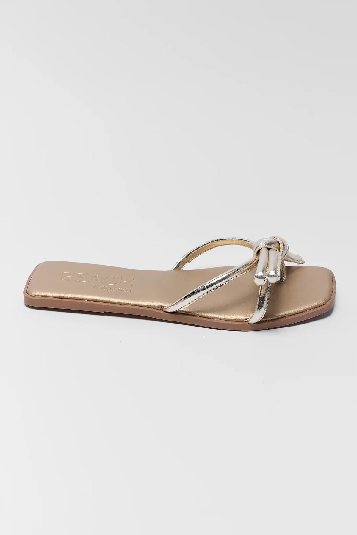 Gold metallic knotted slide sandal side profile view - Ruthie by Matisse | Avara