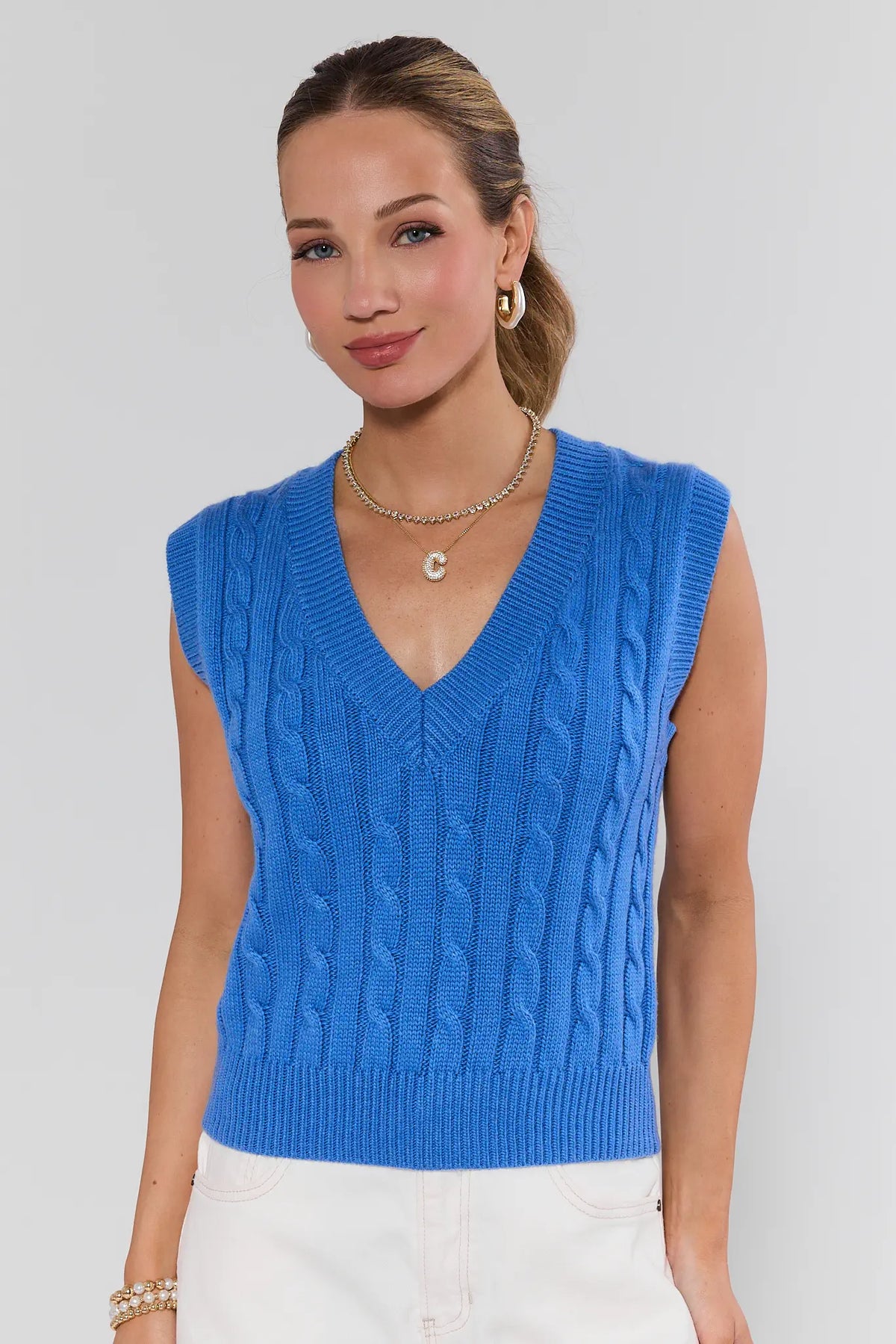 Blue Cable Knit Sweater Vest with V-neckline, front view on model | Avara