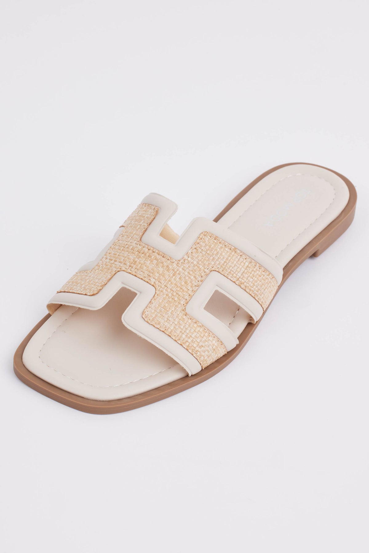 Cream raffia slide sandal with H-strap detail and faux leather trim - Side View | Avara