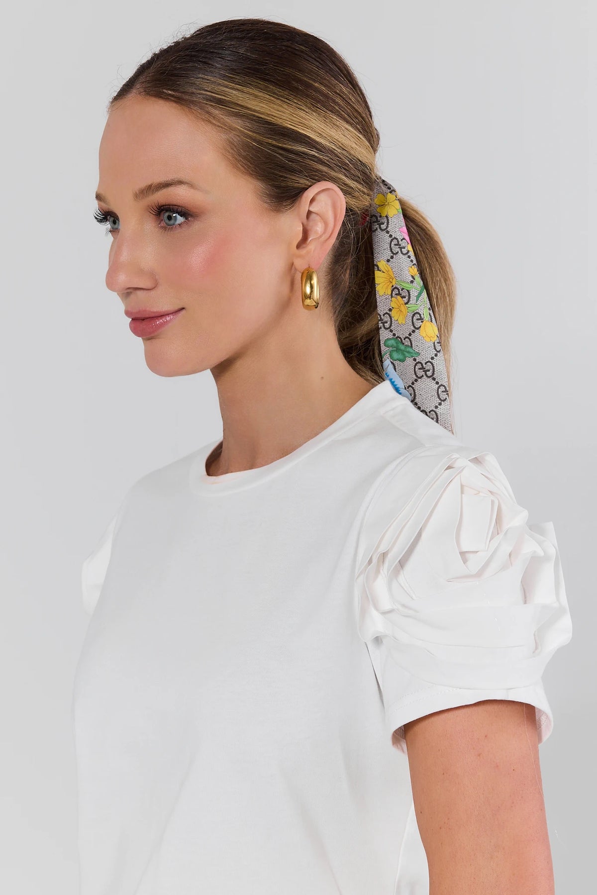 Kendall White Floral Appliqué Top sleeve close-up, 3D rose puff detail on model with floral hair scarf | Avara