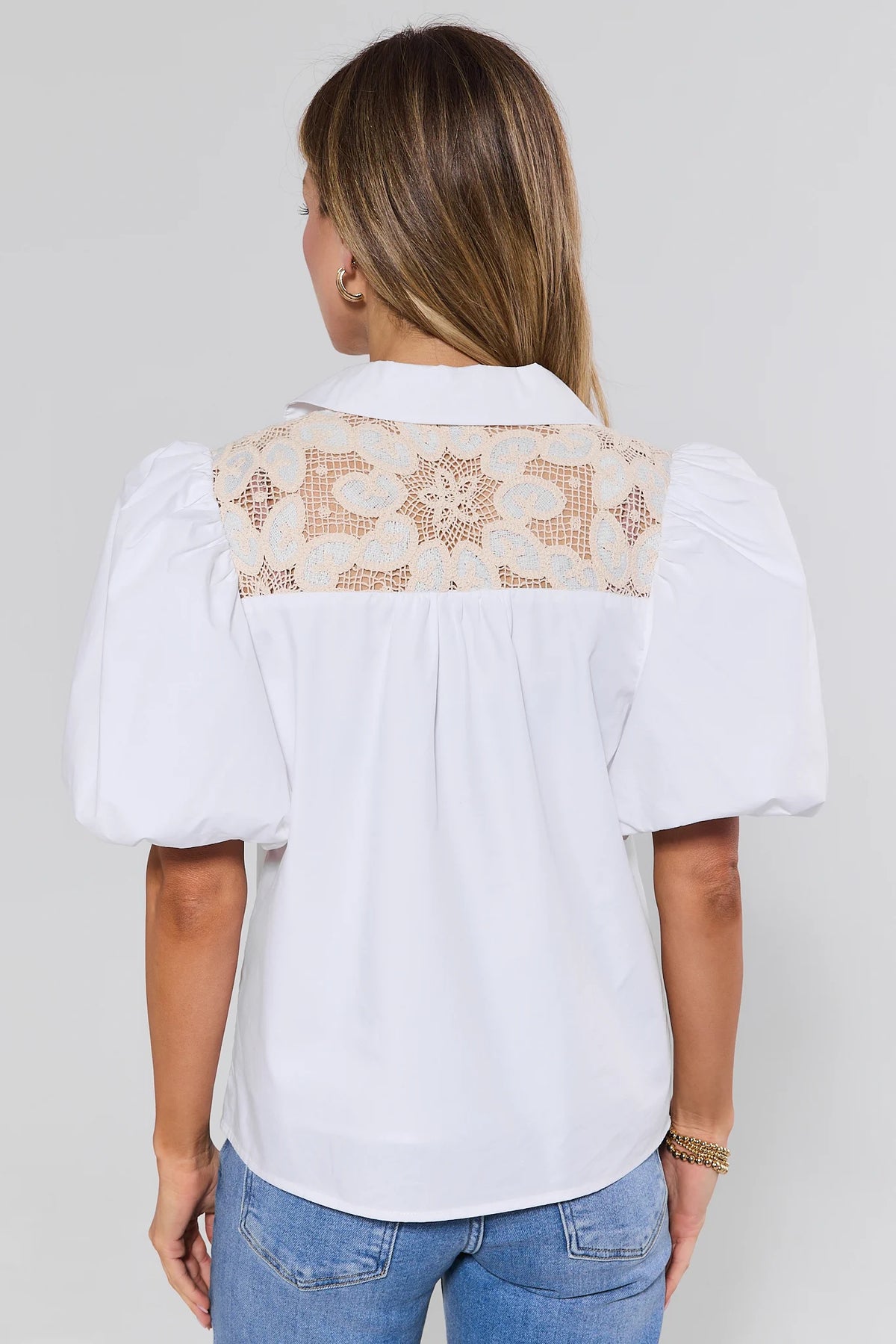 Back view of white crochet lace top showing full floral lace yoke panel across shoulders | Avara