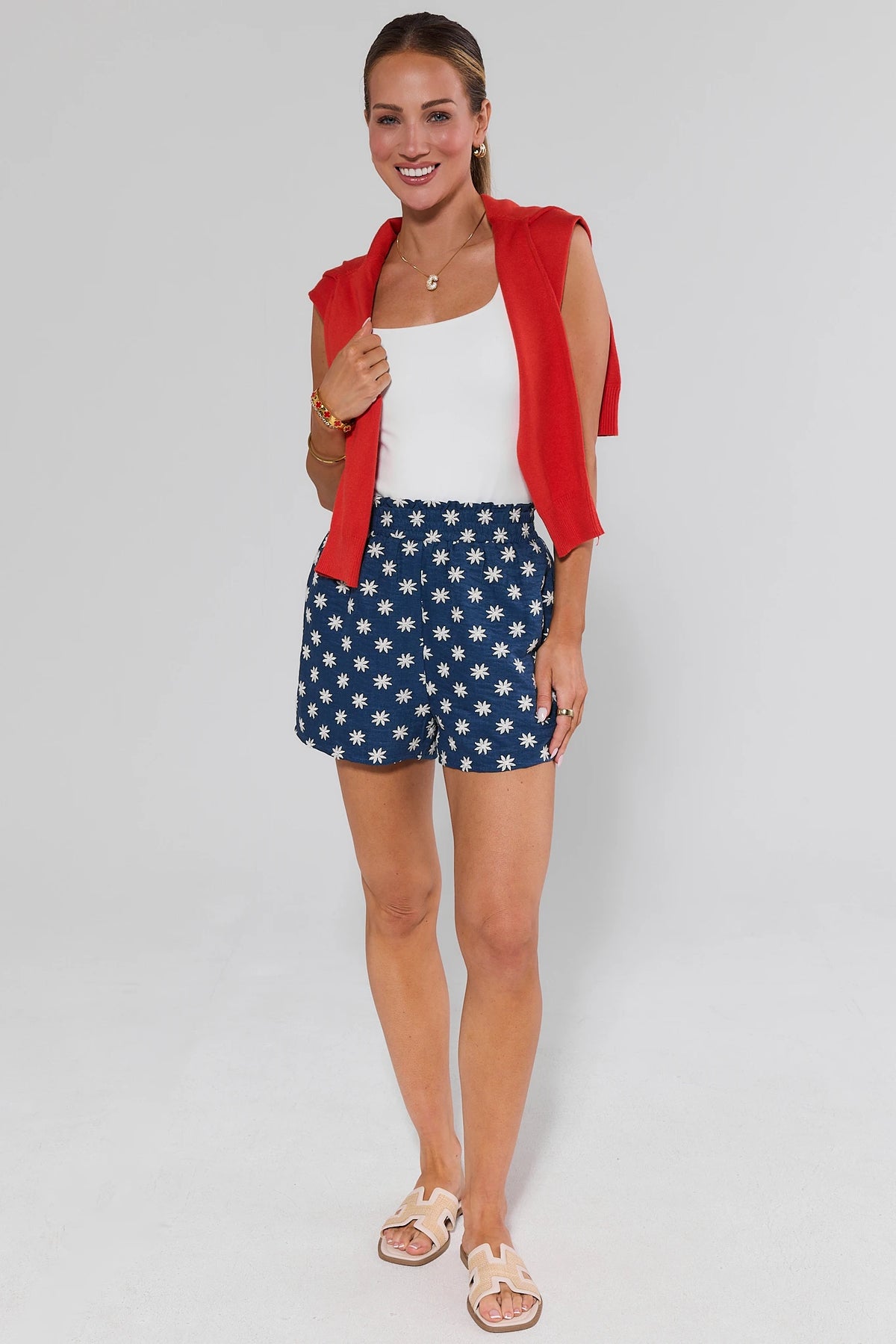 Riley Chambray Embroidered Shorts styled with red vest and white tank, full-length front view | Avara