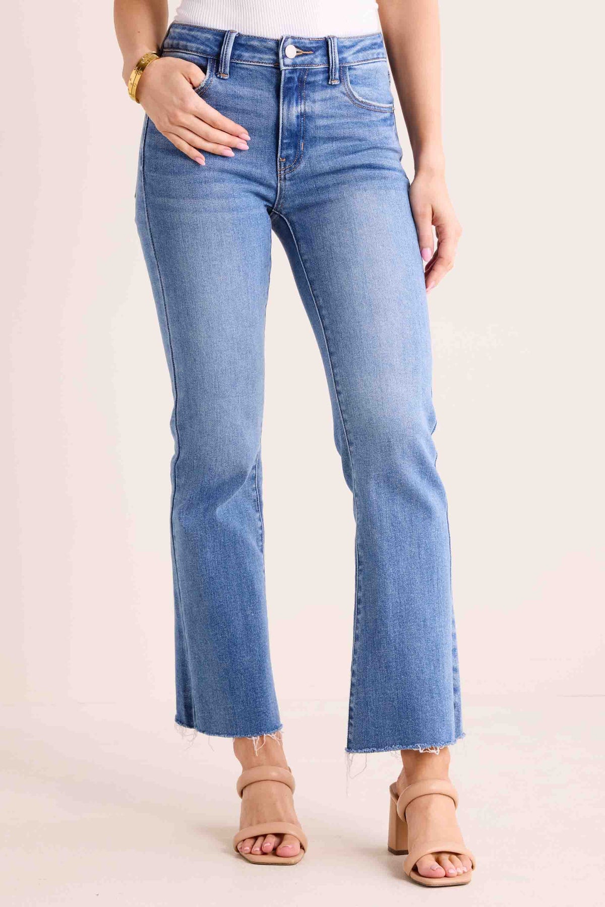 Wendy Medium Wash Kick Flare Jeans - Front Close-Up, Raw-Edge Hem | Avara