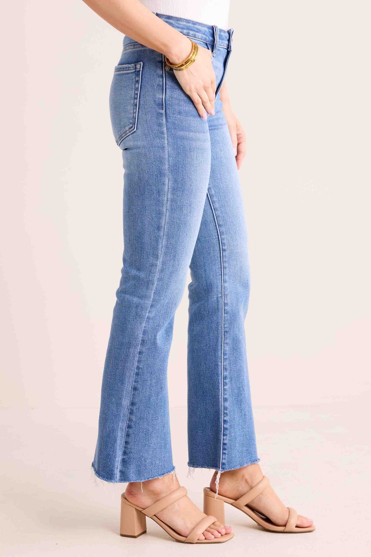 Wendy Medium Wash Kick Flare Jeans - Side Profile, High Rise Silhouette | Avara