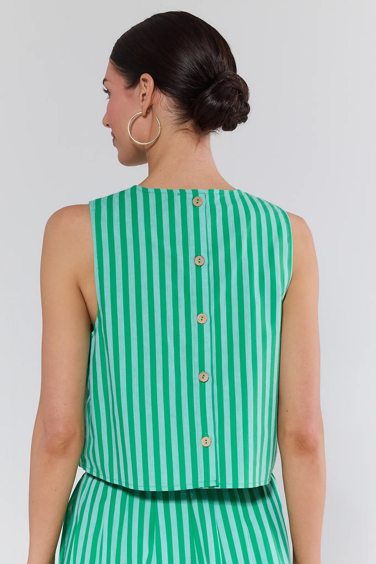 Green and white striped tank top back view showing wooden button closure detail on model | Avara