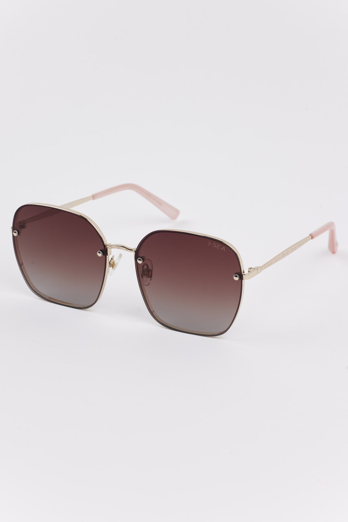 Emerson Round Polarized Sunglasses with a slim metal frame, brown gradient lenses, and rose-gold temples, featuring the subtle “I-SEA” branding on the right lens.
